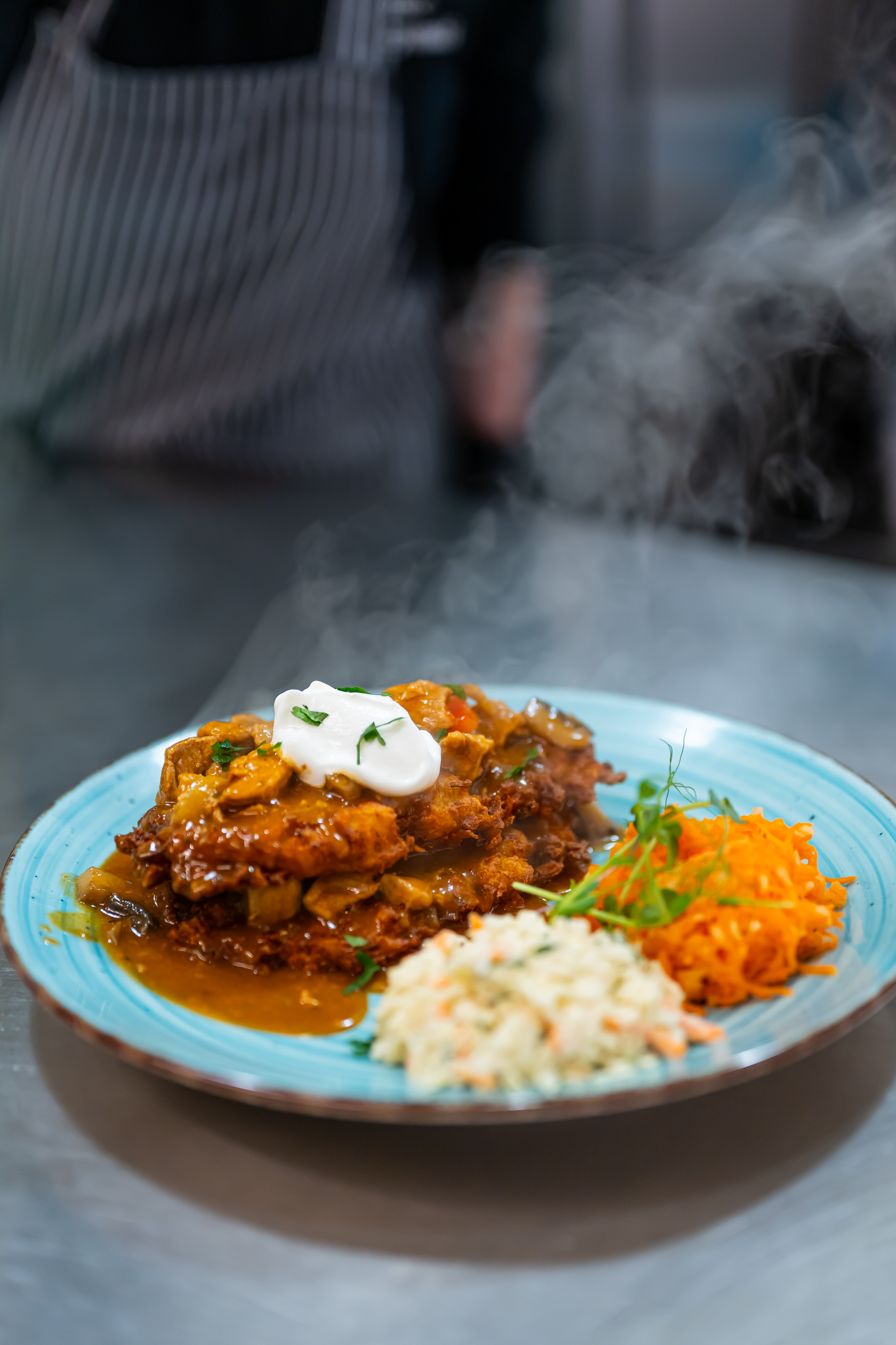 Hungarian-style potato pancakes with pork goulash