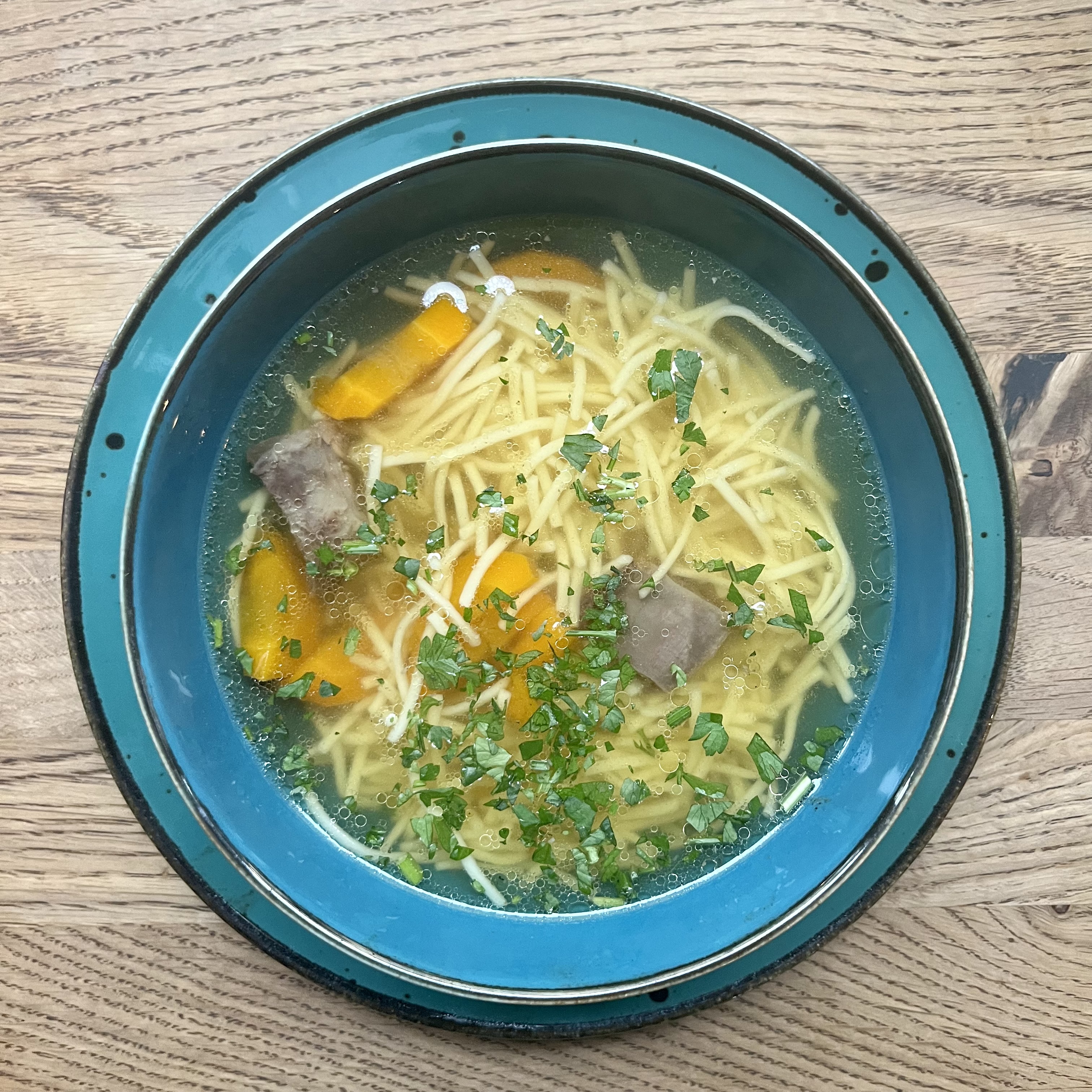 Homemade beef & chicken broth with noodles